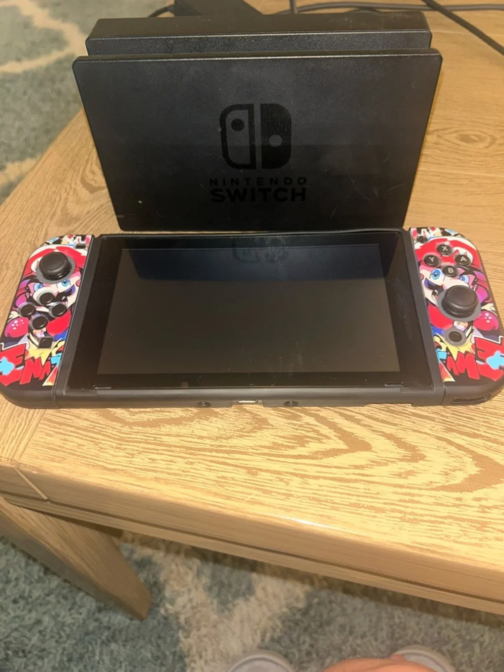 Nintendo Switch with Red, Blue, Black Graphic Controller Wraps